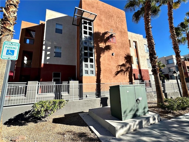 view of building exterior featuring fence