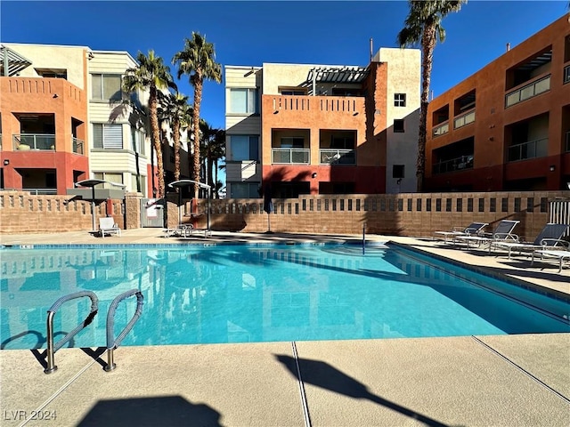 view of pool featuring fence