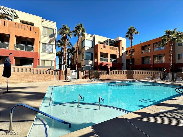 view of pool featuring fence