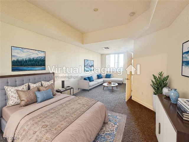 bedroom featuring baseboards, visible vents, a raised ceiling, and carpet flooring