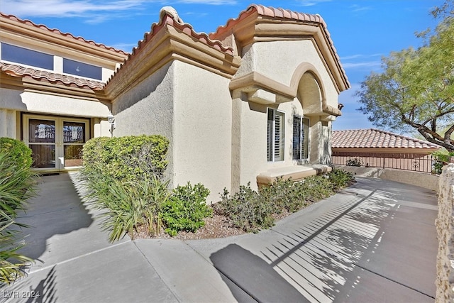 view of side of property with stucco siding