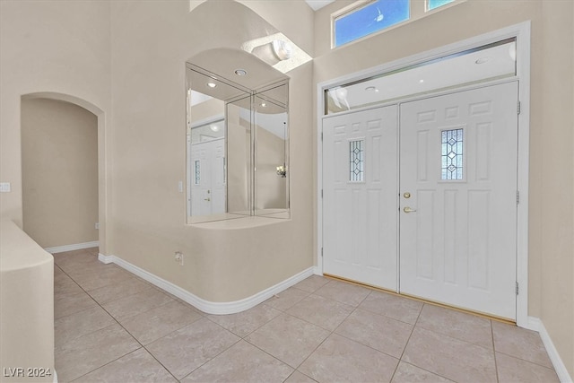 foyer featuring light tile patterned flooring