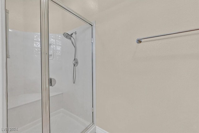 bathroom featuring a shower stall