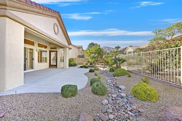 view of yard with a patio area and fence