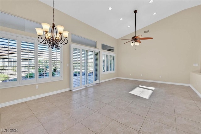empty room featuring ceiling fan with notable chandelier, light tile patterned floors, and recessed lighting