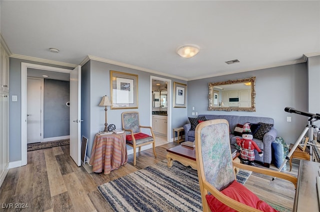 interior space with wood-type flooring and crown molding