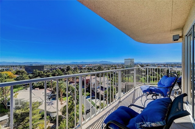 balcony featuring a mountain view