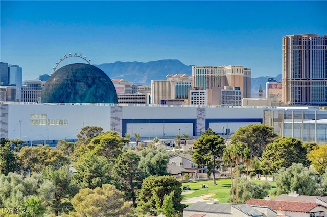 property's view of city featuring a mountain view