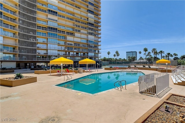 view of swimming pool with a patio area