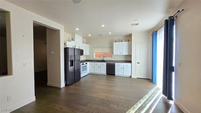 kitchen with black appliances, white cabinetry, sink, and dark wood-type flooring