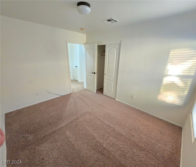 empty room featuring carpet flooring