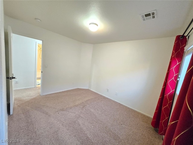 spare room with carpet