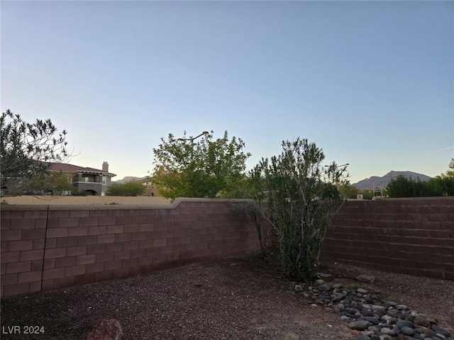 yard at dusk with a mountain view