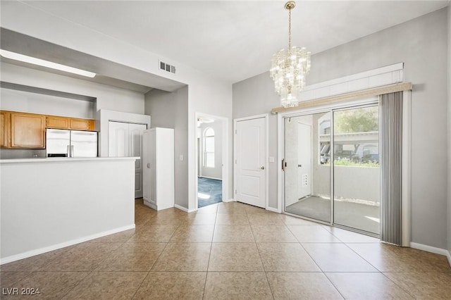 700 Carnegie St Unit 1512, Henderson, NV 89052 - unfurnished dining area with healthy amount of natural light, a chandelier, light tile patterned floors, and baseboards