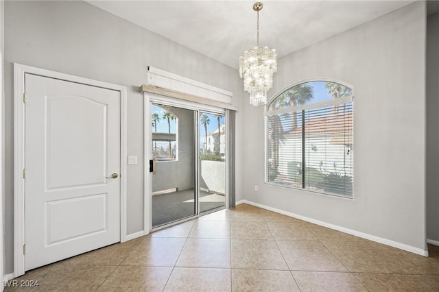 700 Carnegie St Unit 1512, Henderson, NV 89052 - spare room with tile patterned floors, a chandelier, and baseboards