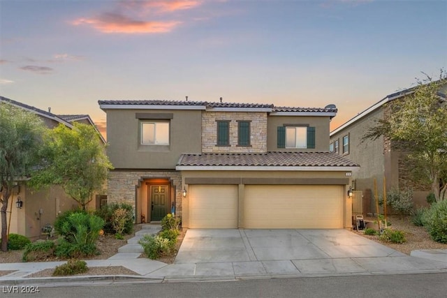 mediterranean / spanish-style house featuring a garage