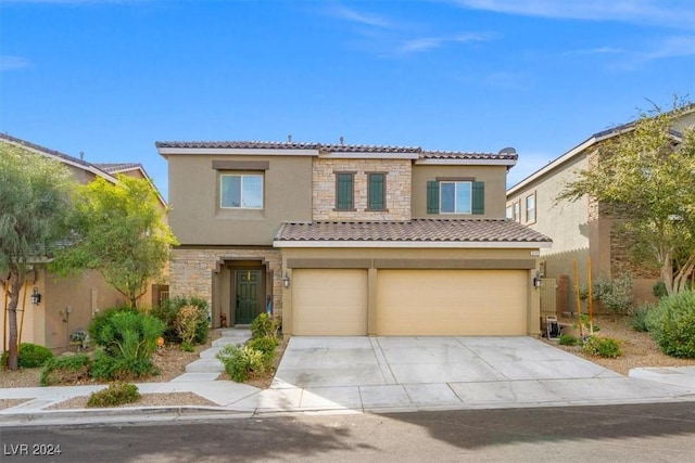 mediterranean / spanish-style home featuring a garage