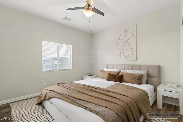 bedroom with wood-type flooring and ceiling fan