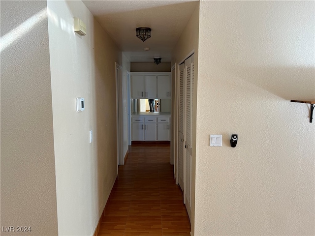 hallway featuring wood-type flooring