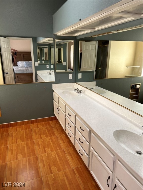 bathroom with vanity and hardwood / wood-style flooring