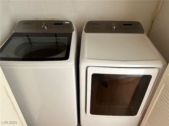 laundry area with washing machine and dryer