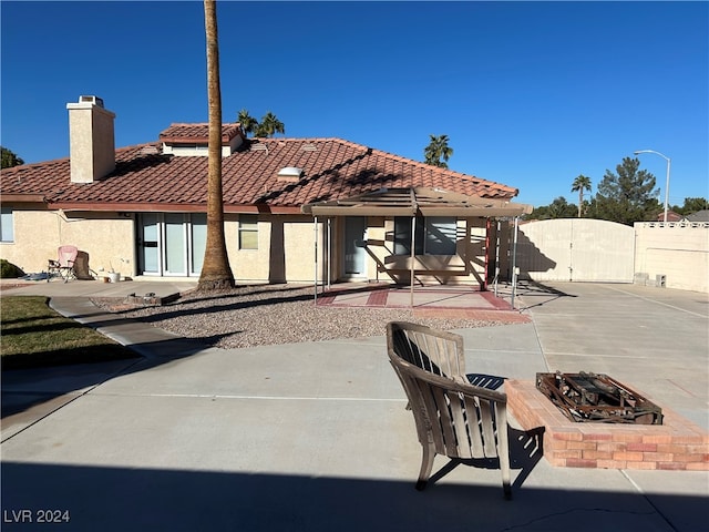 rear view of property featuring a patio area