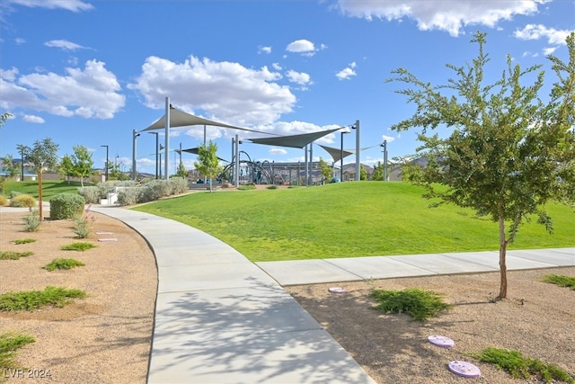 view of property's community with a lawn