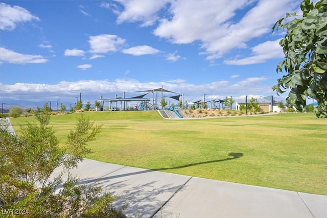 view of home's community with a yard