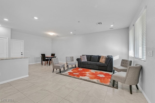 living room with light tile patterned floors