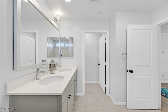 bathroom with tile patterned flooring and vanity