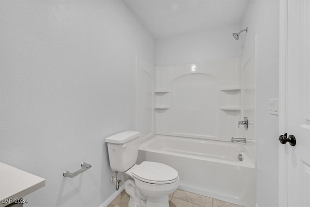 bathroom with tile patterned floors, toilet, and shower / bathing tub combination