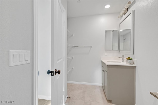 bathroom featuring tile patterned floors and vanity