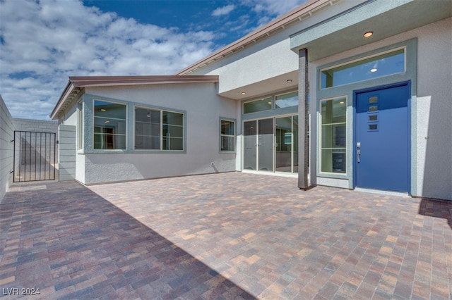 back of house with a patio area