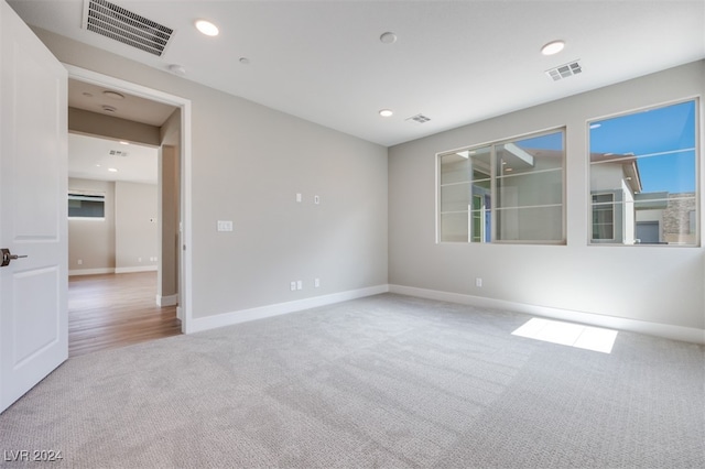 unfurnished room featuring carpet