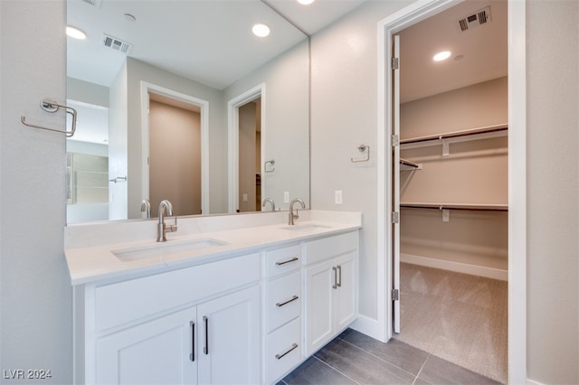 bathroom featuring vanity and tile patterned flooring