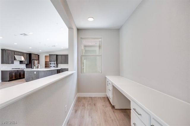 hall featuring sink and light hardwood / wood-style flooring