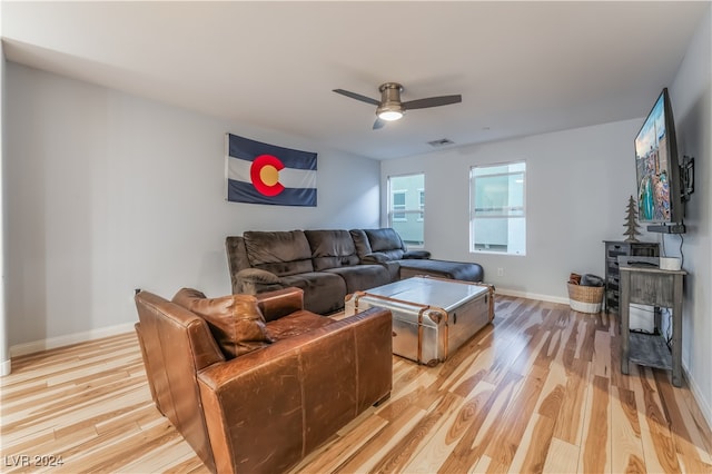 living room with ceiling fan and light wood-type flooring