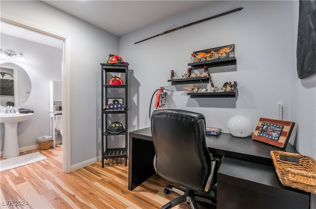 home office with wood-type flooring