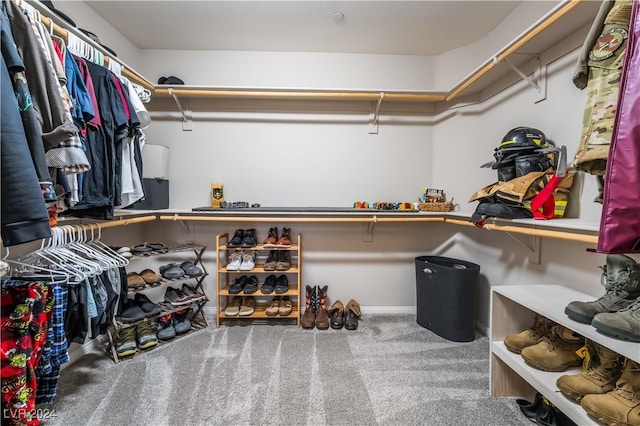 spacious closet with carpet flooring