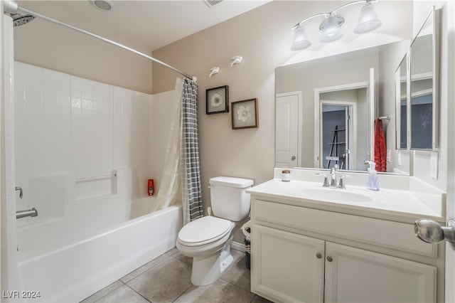 full bathroom featuring toilet, shower / bath combo, vanity, and tile patterned floors