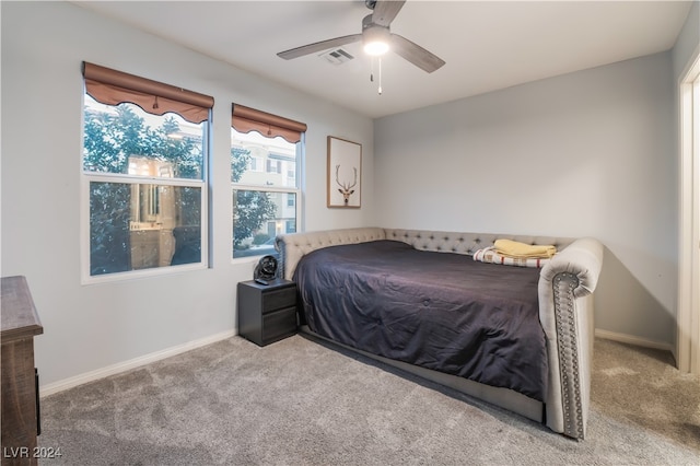 bedroom featuring ceiling fan and light colored carpet