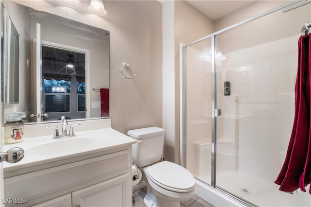 bathroom featuring vanity, toilet, and walk in shower