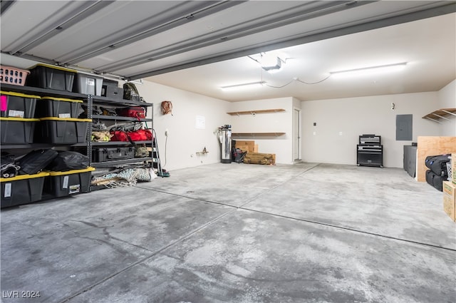 garage featuring a garage door opener and electric panel