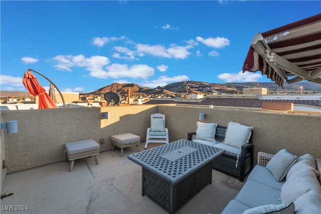 view of patio featuring a mountain view and an outdoor hangout area