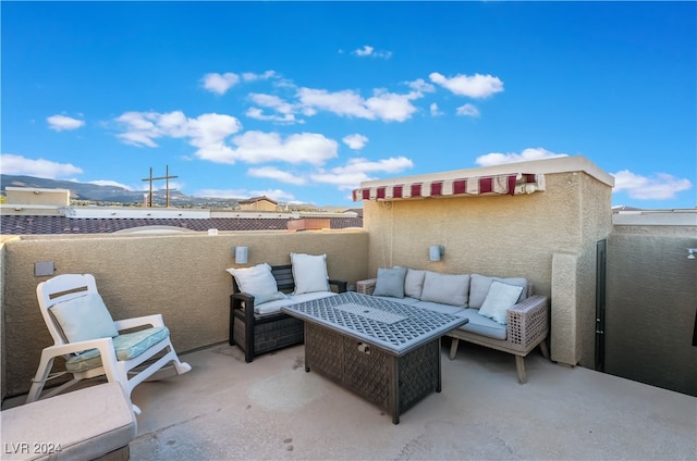 view of patio with a mountain view and an outdoor hangout area