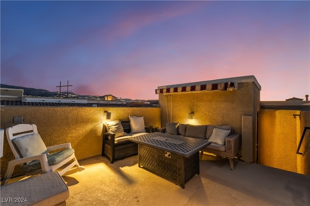 patio terrace at dusk with outdoor lounge area