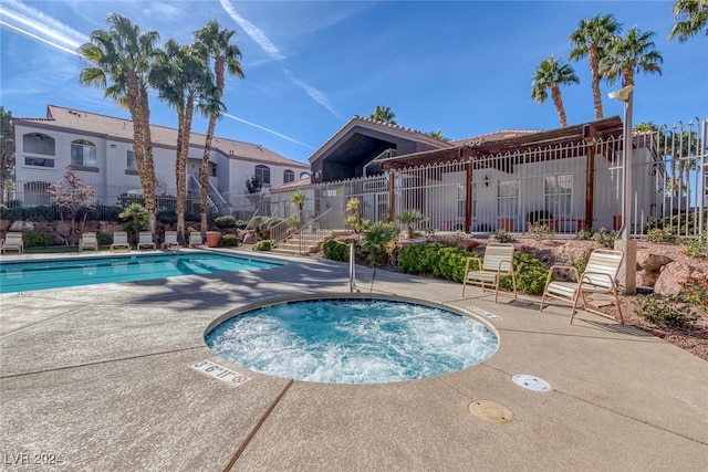 view of pool with a community hot tub