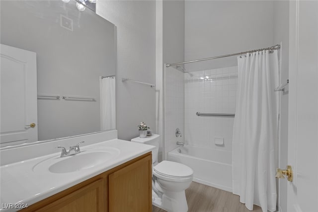 full bathroom with shower / bath combo with shower curtain, toilet, wood-type flooring, and vanity