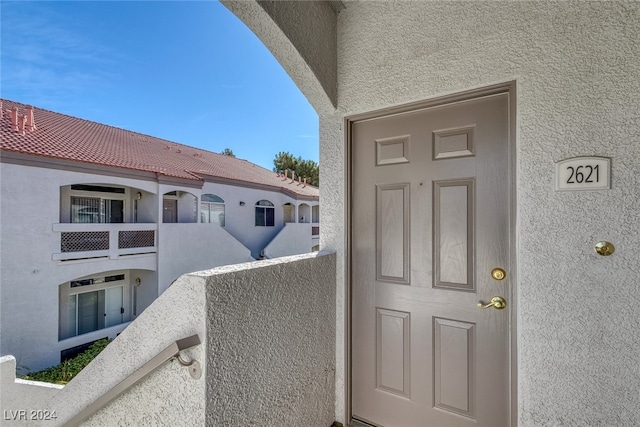 doorway to property with a balcony