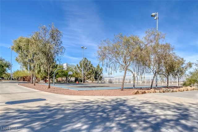 view of property's community with basketball hoop